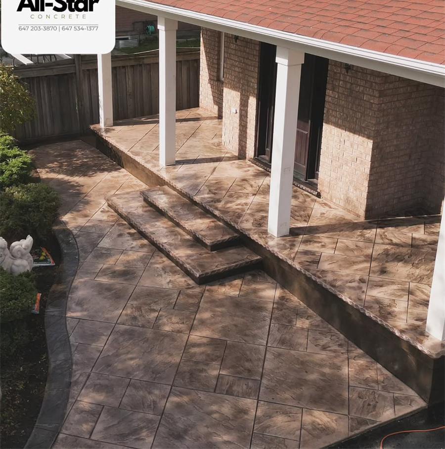 Stamped concrete patio and steps under a covered porch